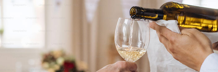 pouring wine into glass